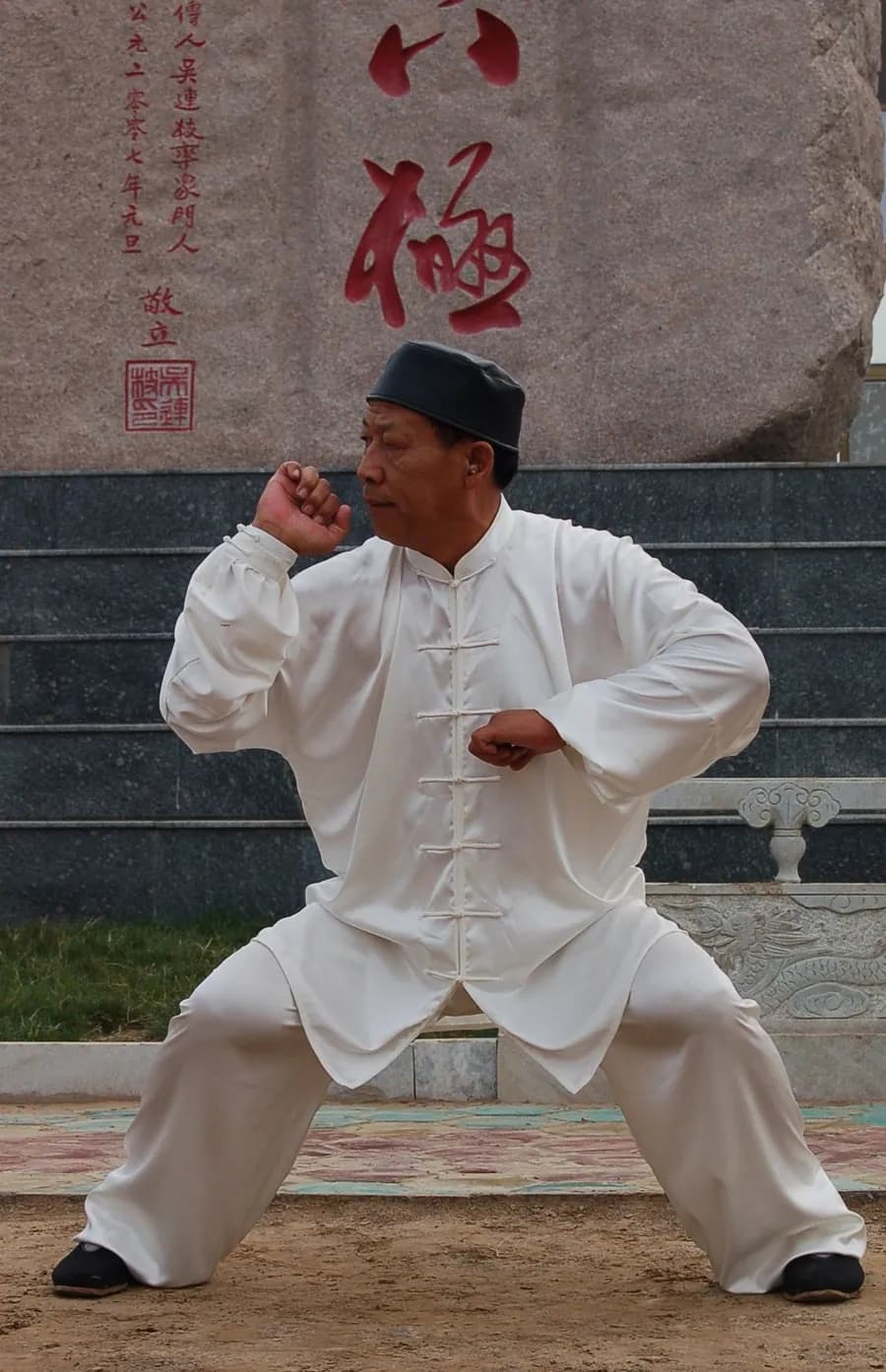 Bajiquan practitioner in a rooted, close-range posture
