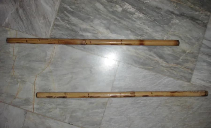 Eskrima practitioner drilling with rattan sticks