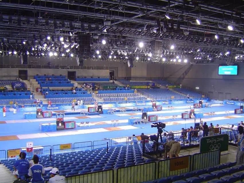 Olympic fencer mid-lunge